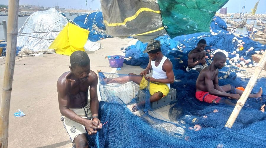 Fishermen-mending-their-nets-Afia-Agyapomaa-Ofosu-scaled