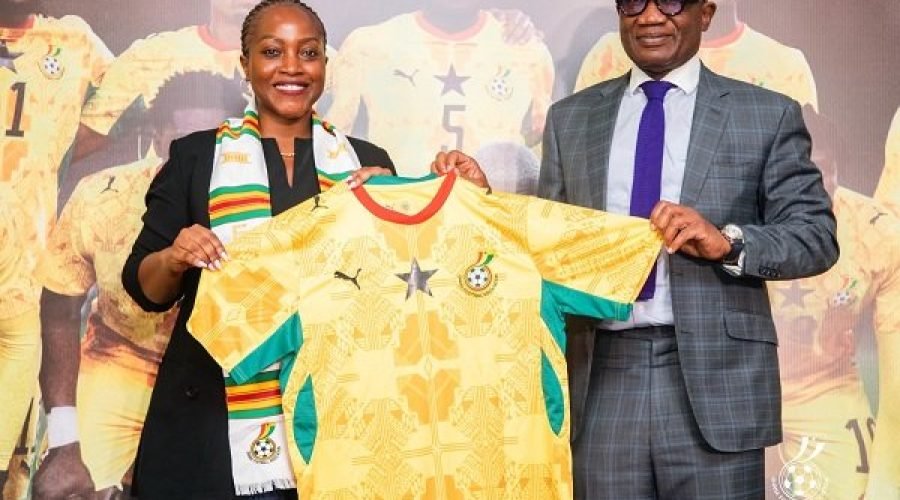 Madam-Ndanyungu-receives-a-signed-Black-Stars-jersey-from-Mr-Addo
