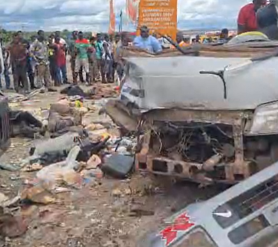 Fatal crash on the Nkenkensu highway showing wreckage of commercial mini-bus and trailer collision in Ashanti Region